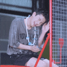 a young man wearing a shirt that says ' youth ' on it