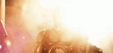 a close up of a person wearing a gas mask in front of a fire .