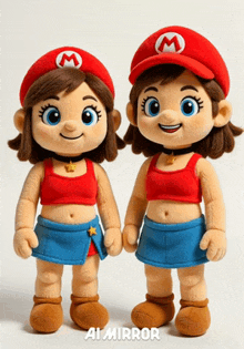 two stuffed mario dolls are standing next to each other on a white surface