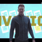 a man in a blue jacket is standing in front of a screen that says iv ic