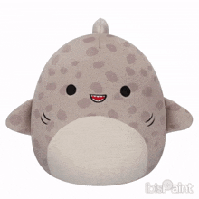 a stuffed animal that looks like a shark has ibis paint written on the bottom