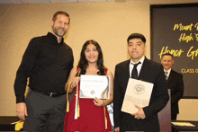 a woman holding a diploma that says honor graduate