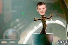 a gif of a plant with a man 's face on it and the words gif jif on the bottom