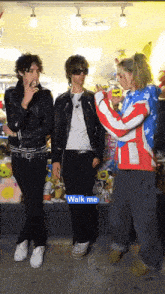 a group of people are standing in front of a sign that says " walk me "