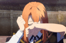 a girl with orange hair is covering her face with her hands