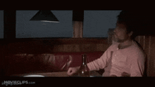 a man sitting at a table with the words " i got that beat " on the bottom