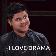 a man wearing a black leather jacket says i love drama