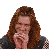 a woman with long red hair is smiling with her hands on her chin