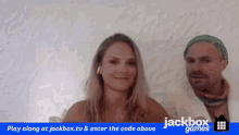 a man and a woman are sitting next to each other with the words jackbox games written on the bottom