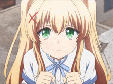 a girl with blonde hair and green eyes has a red x on her head