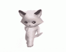 a white cat with black ears and a black nose is standing on a white background .