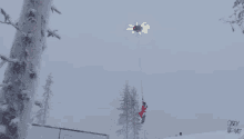 a person in a santa suit is skiing down a snow covered slope