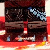 a close up of a lego figure 's feet with the words gold master on them .
