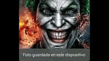 a close up of a joker 's face with a huge smile on his face .