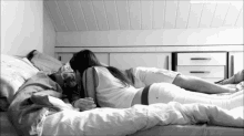kissing in bed couple intimate cuddle