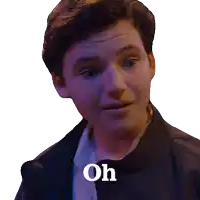 a man in a black jacket says " oh " on his face