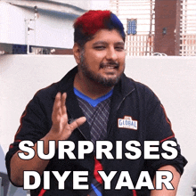 a man with red and blue hair is wearing a jacket that says global