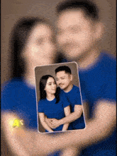 a blurry picture of a man and a woman in blue