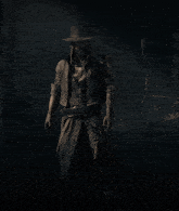 a man in a top hat stands in the dark with a gun belt around his waist