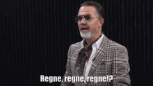 a man in a plaid suit and sunglasses says regne regne regne