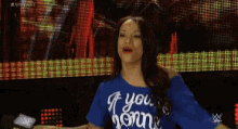 a woman wearing a blue shirt that says " if you 're hungry "