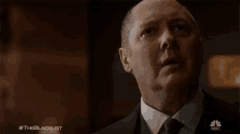 a close up of a man 's face with #theblacklist written below him