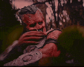 a painting of a monster with a clawed arm and a beard