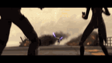 two people are fighting with lightsabers in a video game .