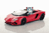 a red toy car with a robot on top