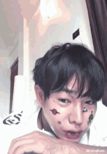 a close up of a person 's face with the name thisisakate visible