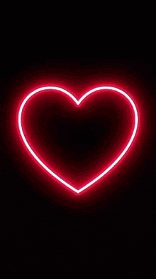 a neon sign that says fuego latino with a heart in the center