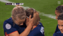 a soccer game between wol and lyo is being shown on a television screen