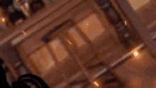 a blurred image of a shelf with bottles and a picture on it