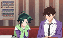 a boy and a girl are sitting in front of a menu