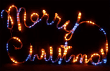 a sign that says merry christmas in red and green lights