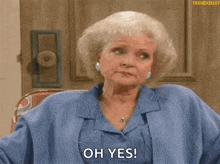 a woman in a blue jacket is sitting in front of a door and says oh yes .