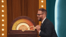 a man in a suit is playing a game that says all bits no bits
