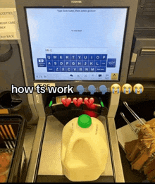 a milk bottle sits in front of a toshiba computer