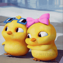 a couple of cartoon chicks standing next to each other with one wearing a pink bow and sunglasses