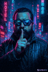 a man wearing sunglasses holds his finger to his mouth in front of a hotel sign