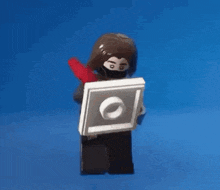 a lego figure with a picture of a man and the words " true " on it