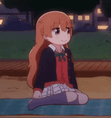 a girl in a school uniform is sitting on the ground with her legs crossed