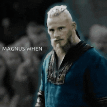 a man with a beard is standing in front of a crowd with the words magnus when written below him
