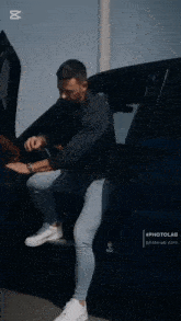 a man getting out of a car with the word cut on the bottom right