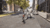 a man in a spiderman suit is fighting a monster on a city street