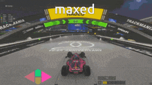 a red bull race car is driving on a track in a video game called maxed