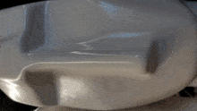 a close up of a white object that looks like a car