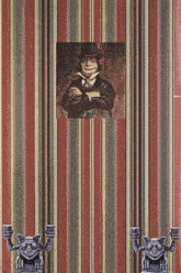 a striped wallpaper with a picture of a man in a top hat and gargoyles holding candles