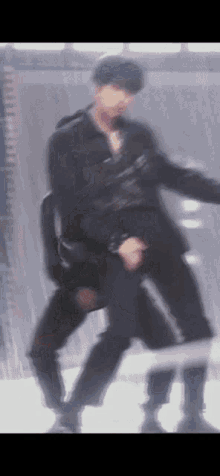 a blurry picture of a man dancing with another man