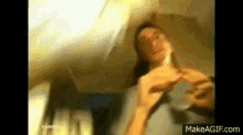 a blurry picture of a man with the website makeagif.com visible in the corner
